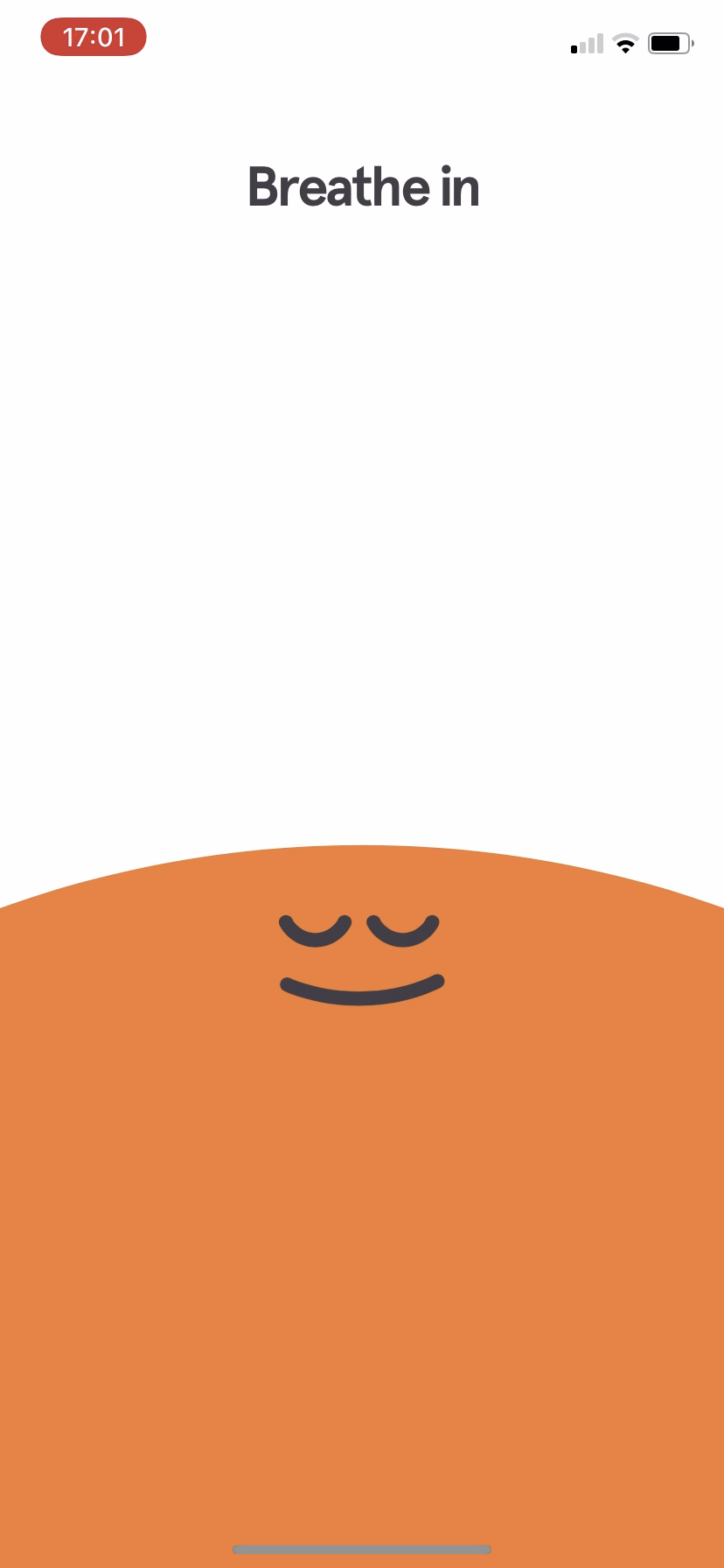 Headspace breathe-in screen with a calm orange face.